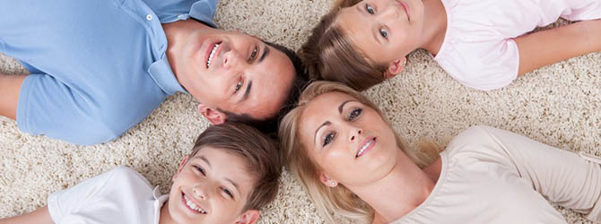 Close-up Of Happy Family Looking Up Together